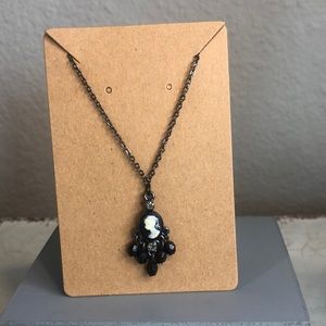 Vintage looking black onyx cameo necklace.